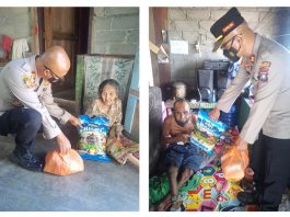 Kapolsek-KUTA,-Iptu-Sasmintoro,-saat-menyerahkan-bantuan-sembako