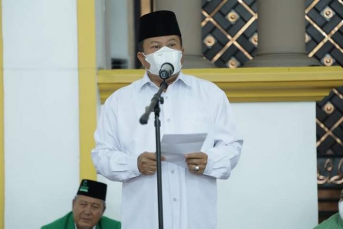 Asisten Perekonomian dan Pembangunan Kabupaten Asahan menyampaikan pidatonya dalam acara Dakwah dan Zikir Ar-Ridha Aljami'yatul Washliyah