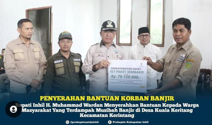 Bupati Inhil, HM Wardan Serahkan Bantuan Korban Banjir Di Kuala Krintang