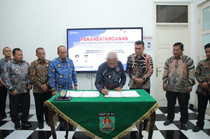 Penandatanganan NPHD Antara Pemerintah Daerah Kabupaten Asahan dengan KPU Asahan